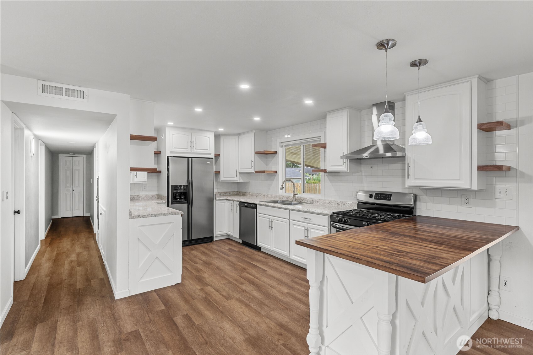 2229 Southwest 330th Street Federal Way, WA 98023 - Photo 26 of 30 a kitchen with white cabinets and stainless steel appliances