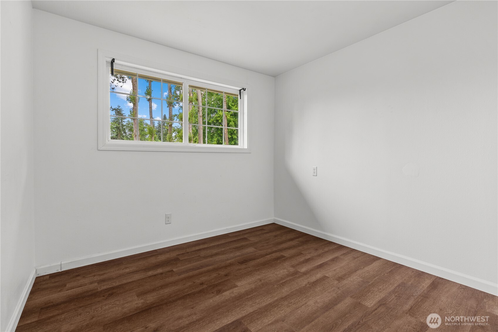 2229 Southwest 330th Street Federal Way, WA 98023 - Photo 29 of 30 a view of an empty room with wooden floor and a window