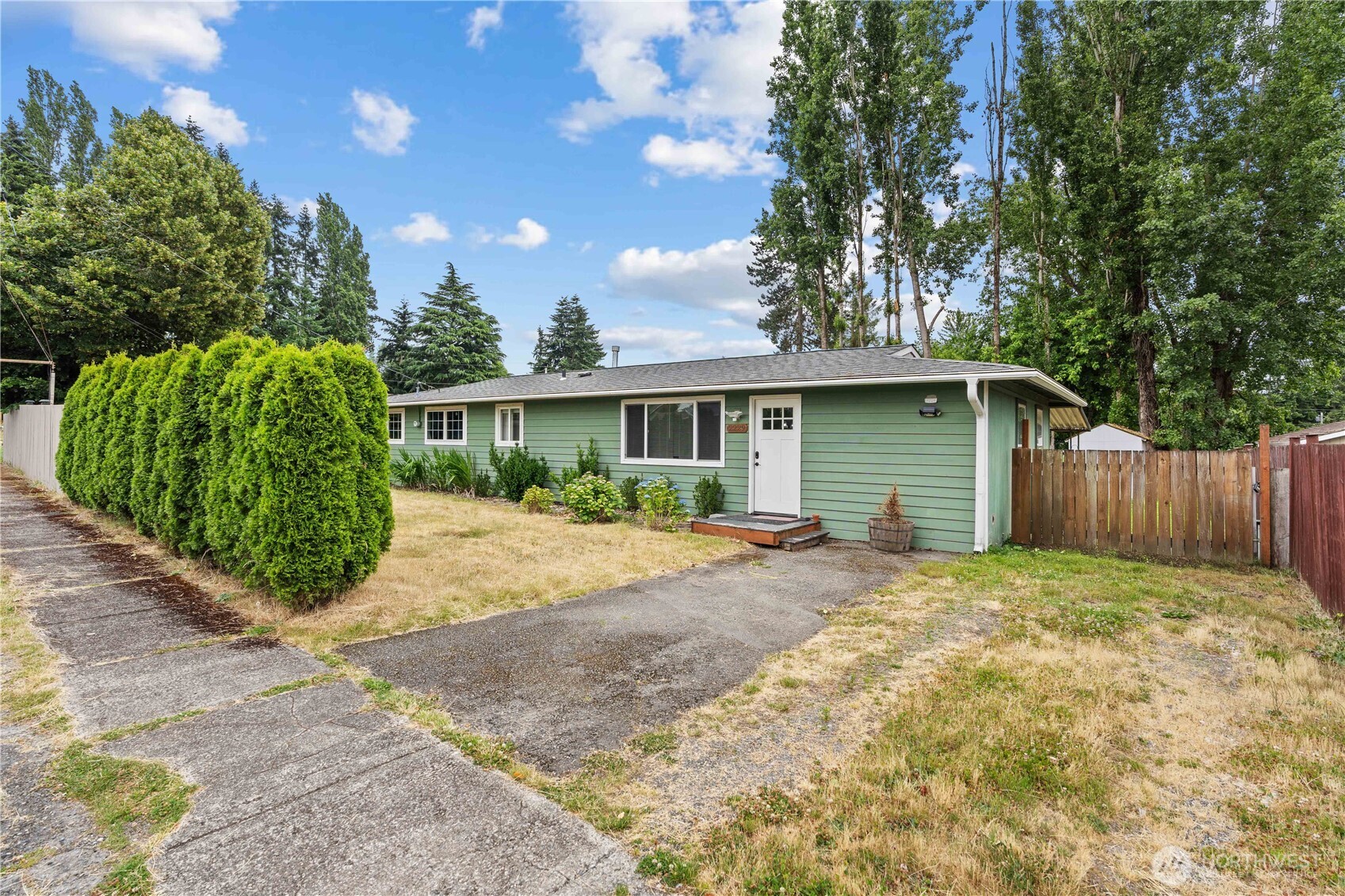 2229 Southwest 330th Street Federal Way, WA 98023 - Photo 4 of 30 a view of a house with a yard and potted plants