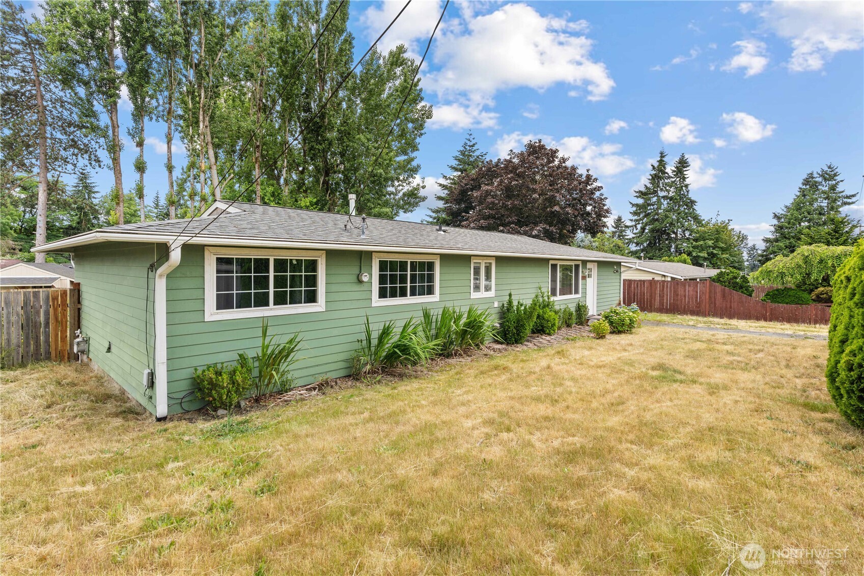 2229 Southwest 330th Street Federal Way, WA 98023 - Photo 5 of 30 a front view of a house with a garden