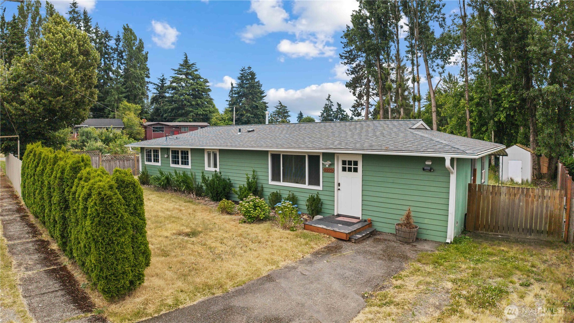 2229 Southwest 330th Street Federal Way, WA 98023 - Photo 6 of 30 a front view of a house with garden