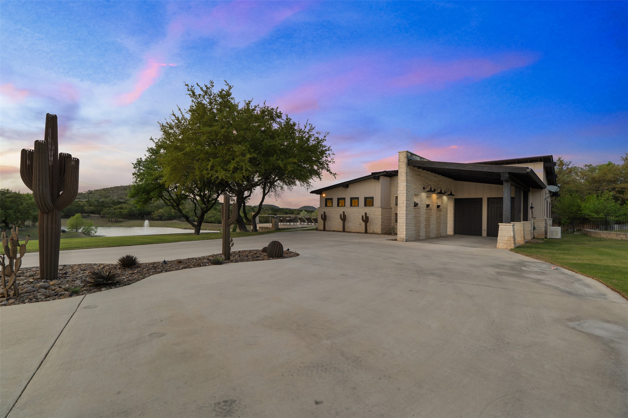 101 Rolling Hills Road Blanco, TX 78606 - Photo 3 of 40 a front view of a house with a yard and trees