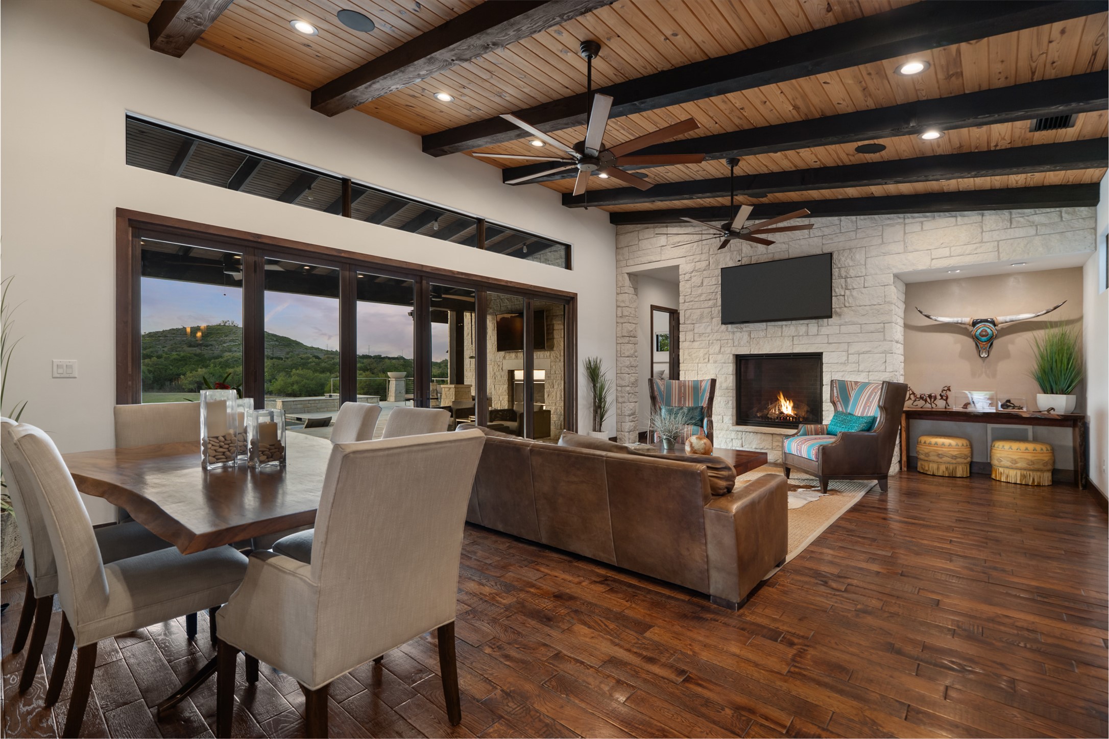 101 Rolling Hills Road Blanco, TX 78606 - Photo 10 of 40 a living room with furniture a fireplace and a floor to ceiling window