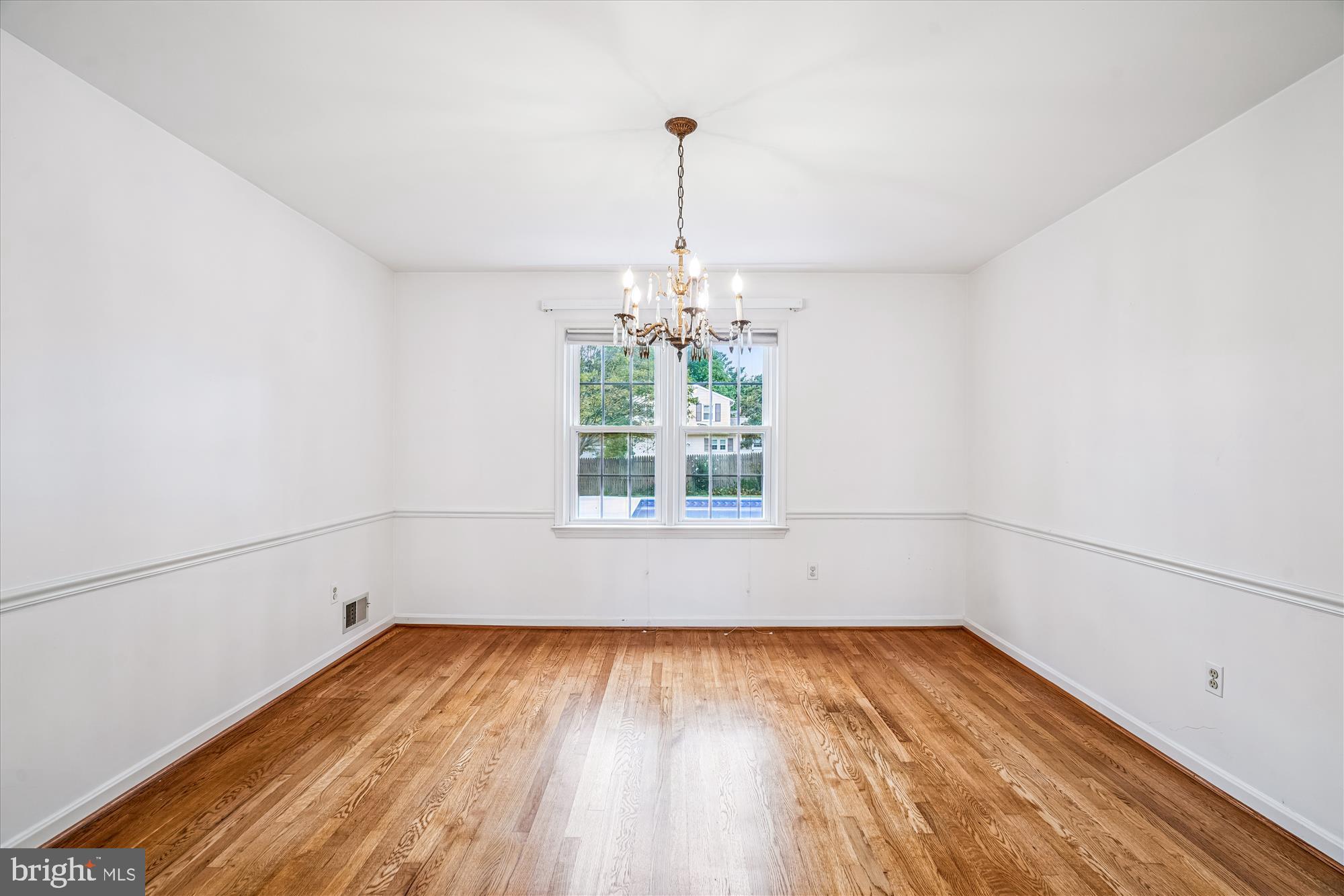 1913 Hopefield Road Silver Spring, MD 20905 - Photo 11 of 58 a view of a room with wooden floor and a window