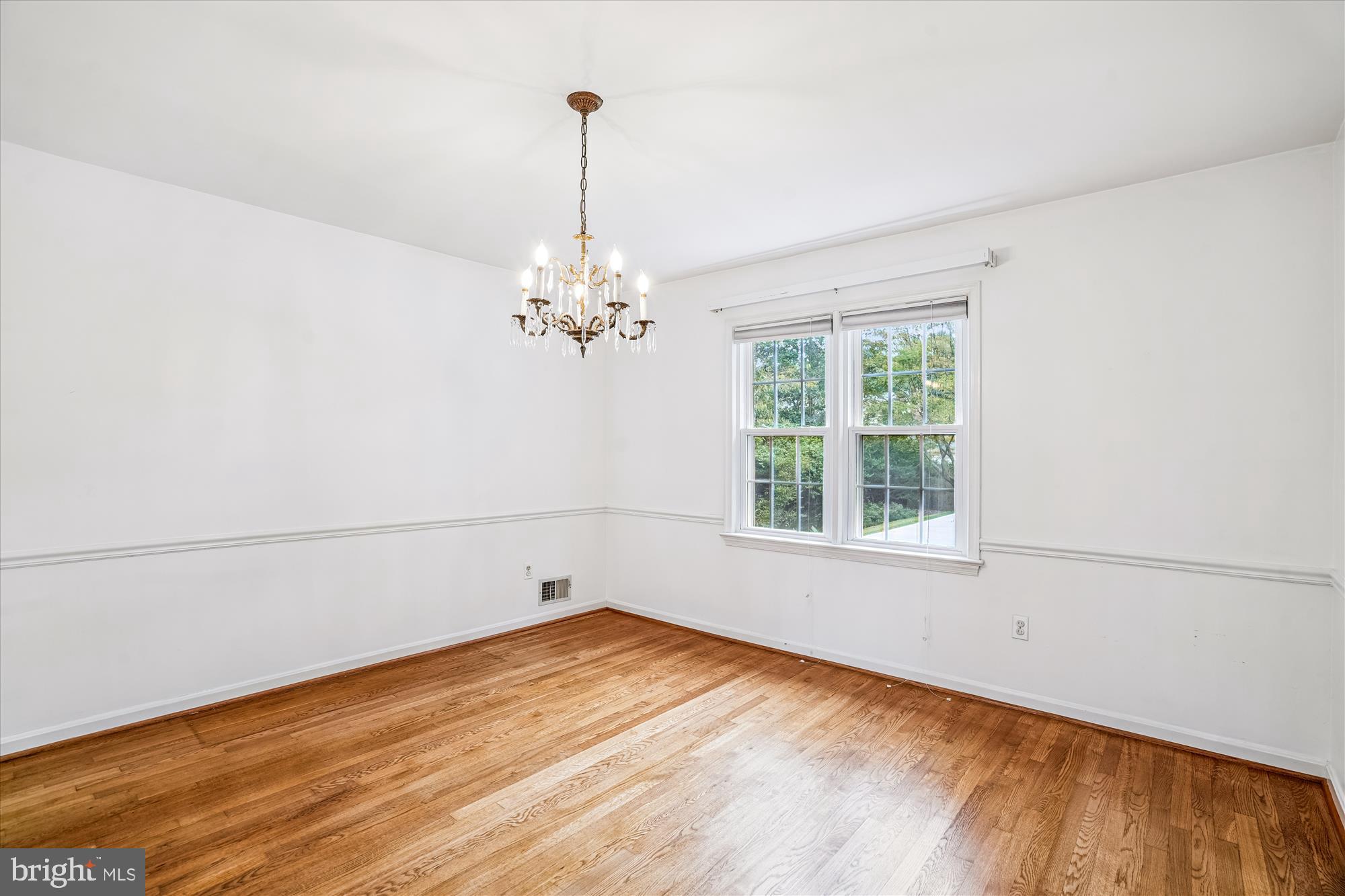 1913 Hopefield Road Silver Spring, MD 20905 - Photo 12 of 58 a view of empty room with wooden floor and fan