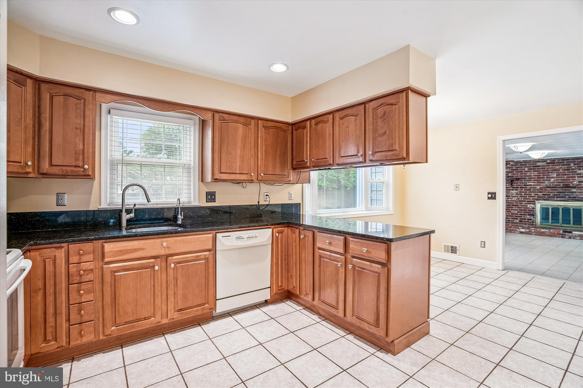 1913 Hopefield Road Silver Spring, MD 20905 - Photo 16 of 58 a kitchen with stainless steel appliances granite countertop a sink and a white cabinets