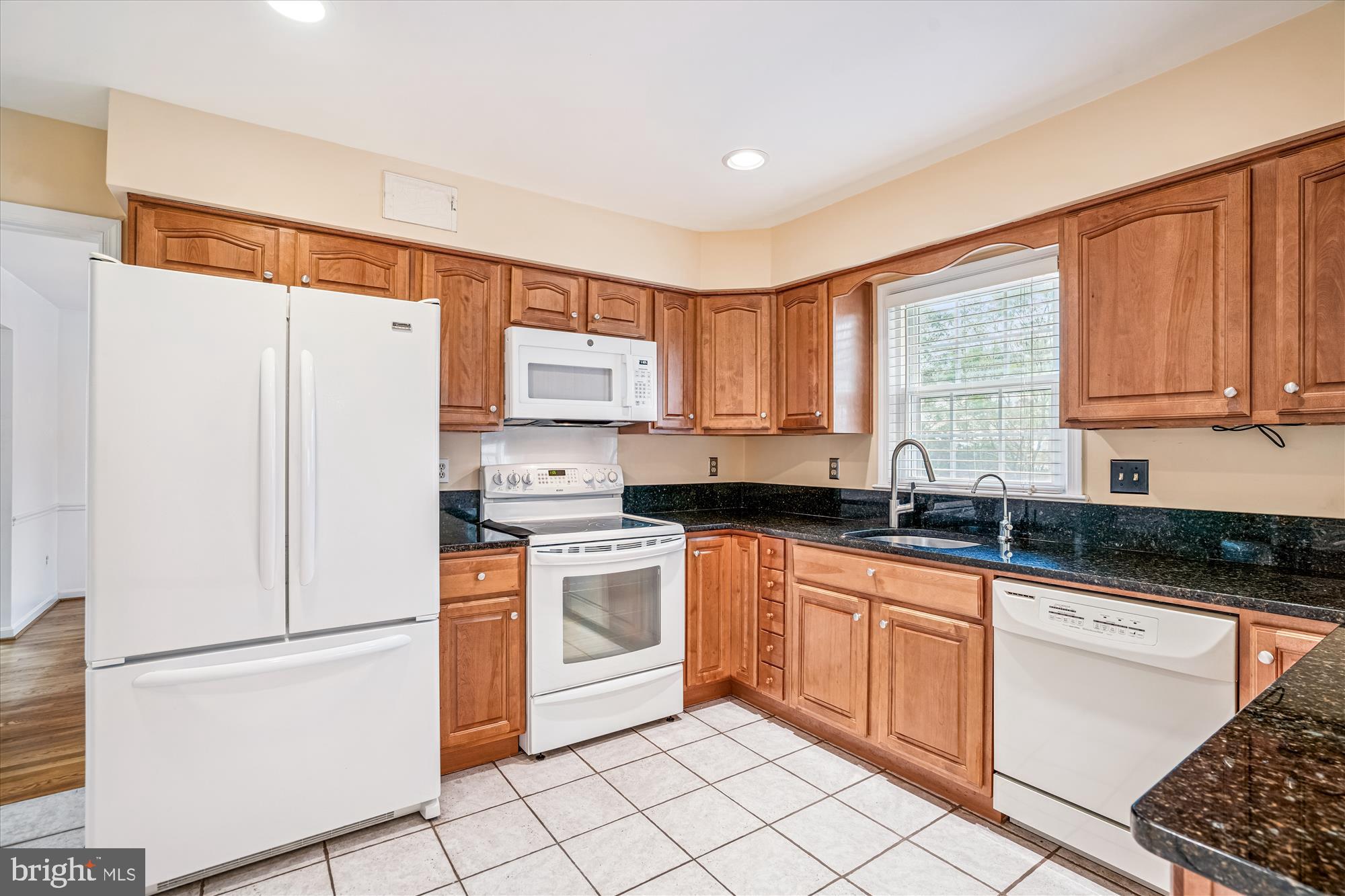 1913 Hopefield Road Silver Spring, MD 20905 - Photo 18 of 58 a kitchen with stainless steel appliances granite countertop a refrigerator sink and stove