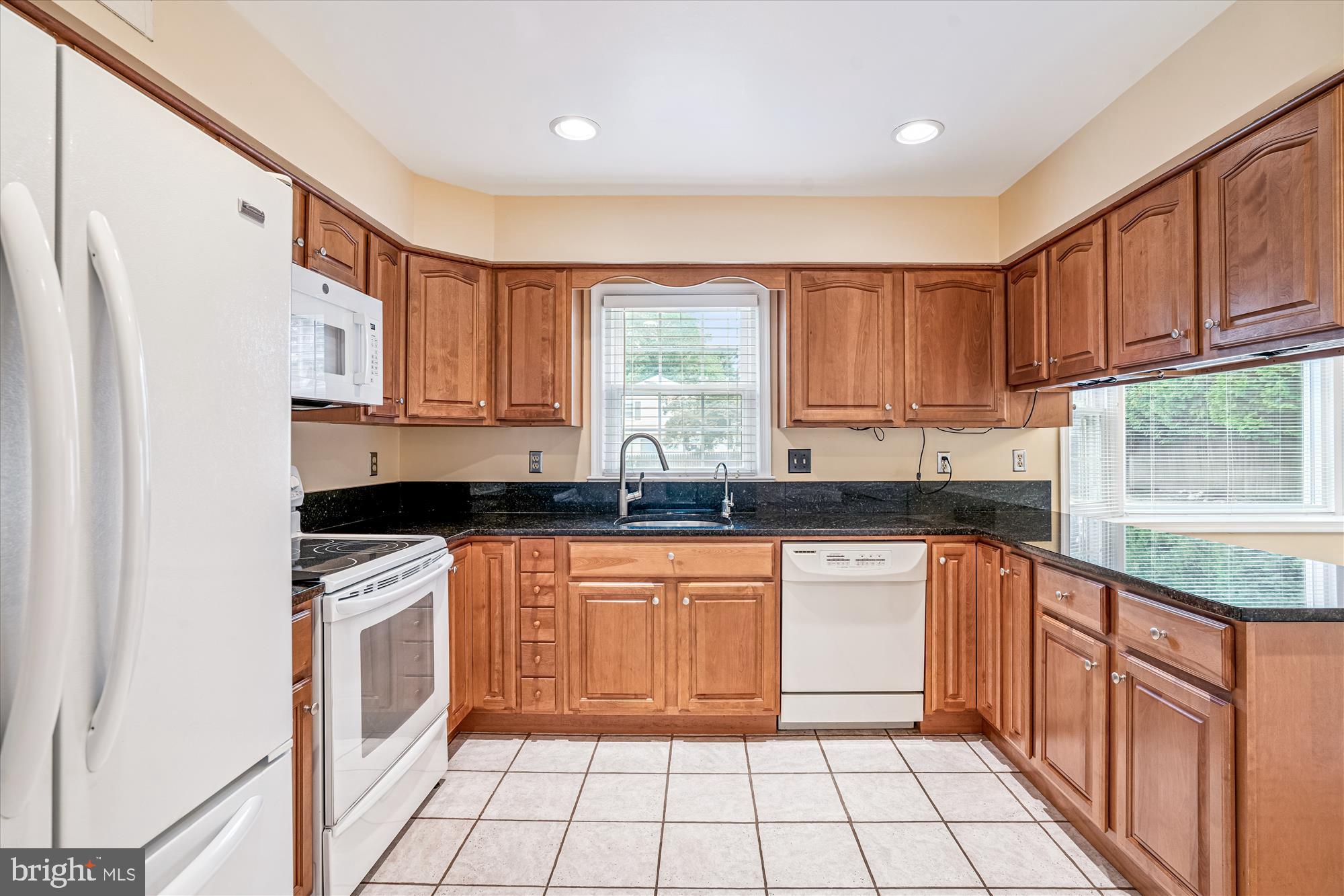 1913 Hopefield Road Silver Spring, MD 20905 - Photo 19 of 58 a kitchen with stainless steel appliances granite countertop a stove a sink dishwasher and a refrigerator