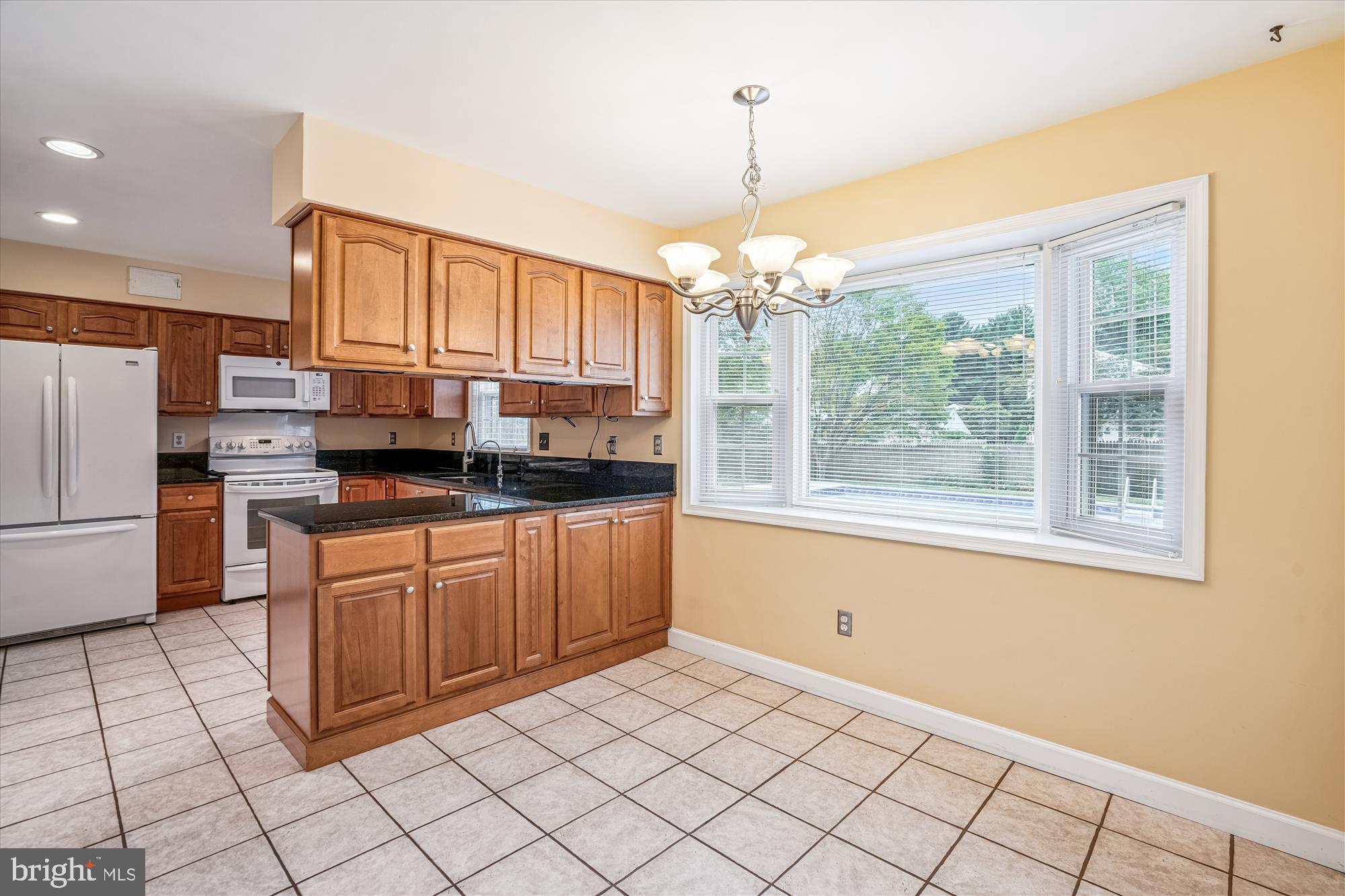 1913 Hopefield Road Silver Spring, MD 20905 - Photo 20 of 58 a kitchen with stainless steel appliances a refrigerator sink and cabinets