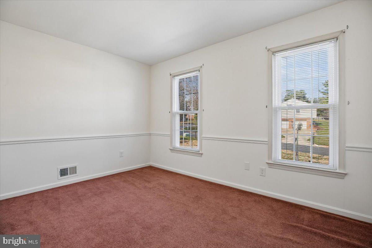 1913 Hopefield Road Silver Spring, MD 20905 - Photo 27 of 58 an empty room with windows