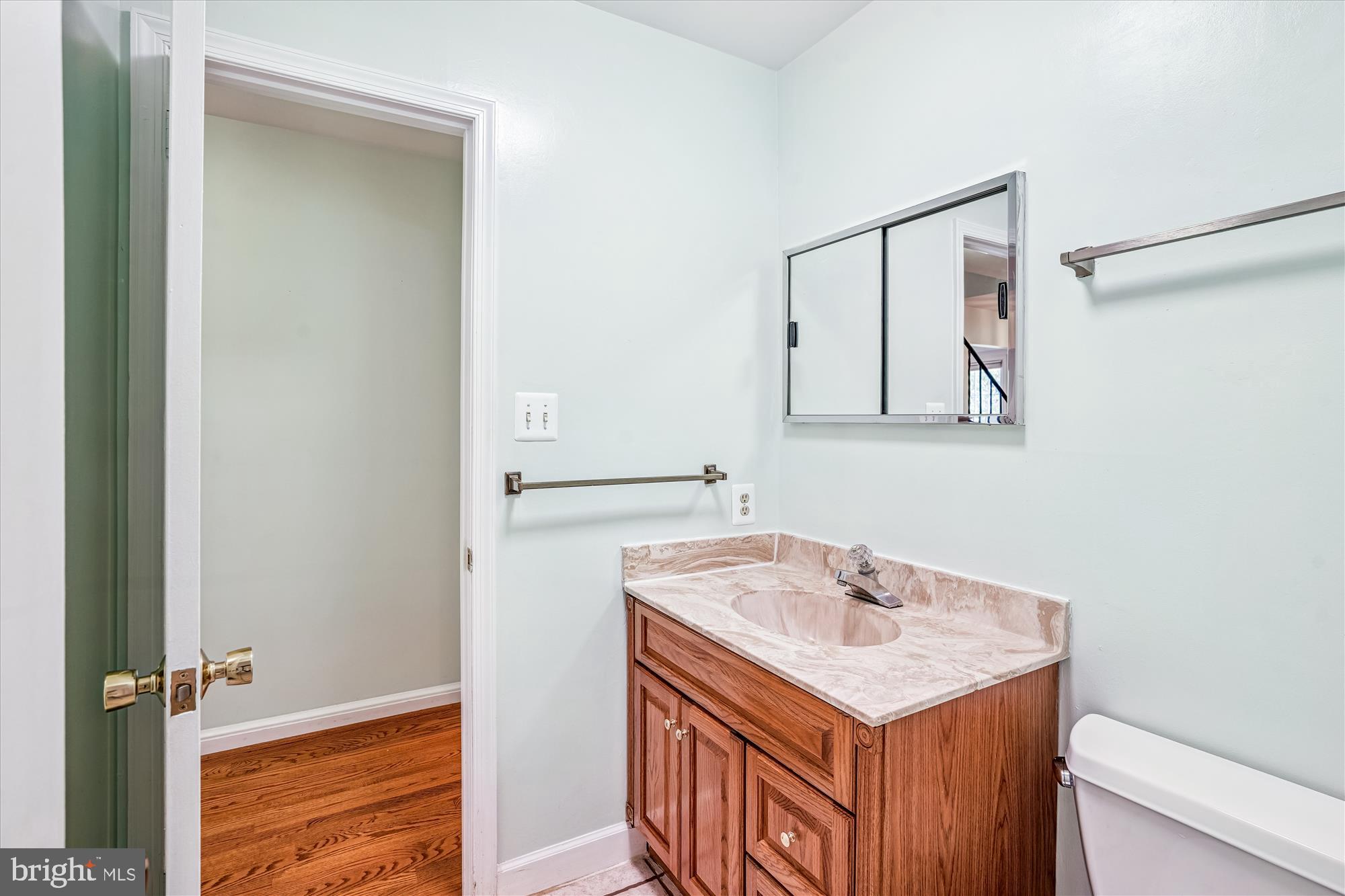 1913 Hopefield Road Silver Spring, MD 20905 - Photo 28 of 58 a bathroom with a sink a vanity and a mirror