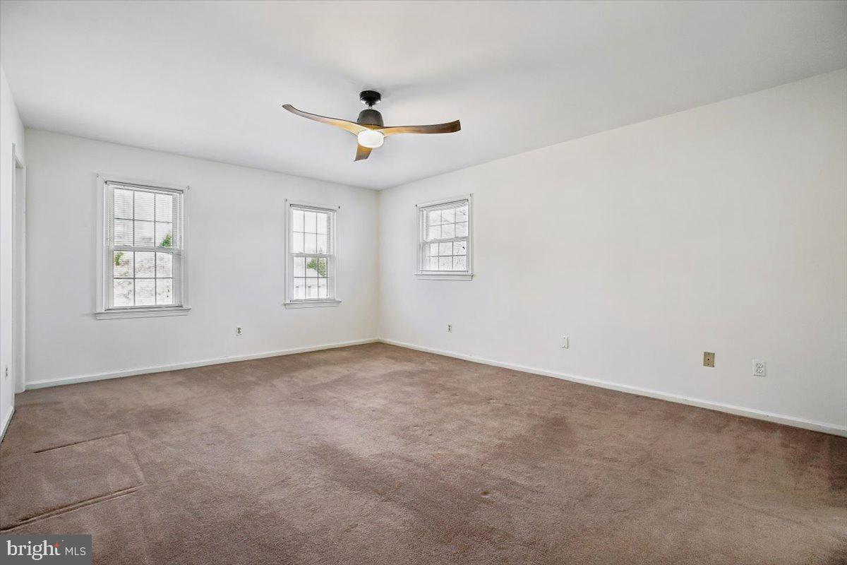 1913 Hopefield Road Silver Spring, MD 20905 - Photo 29 of 58 an empty room with windows and fan