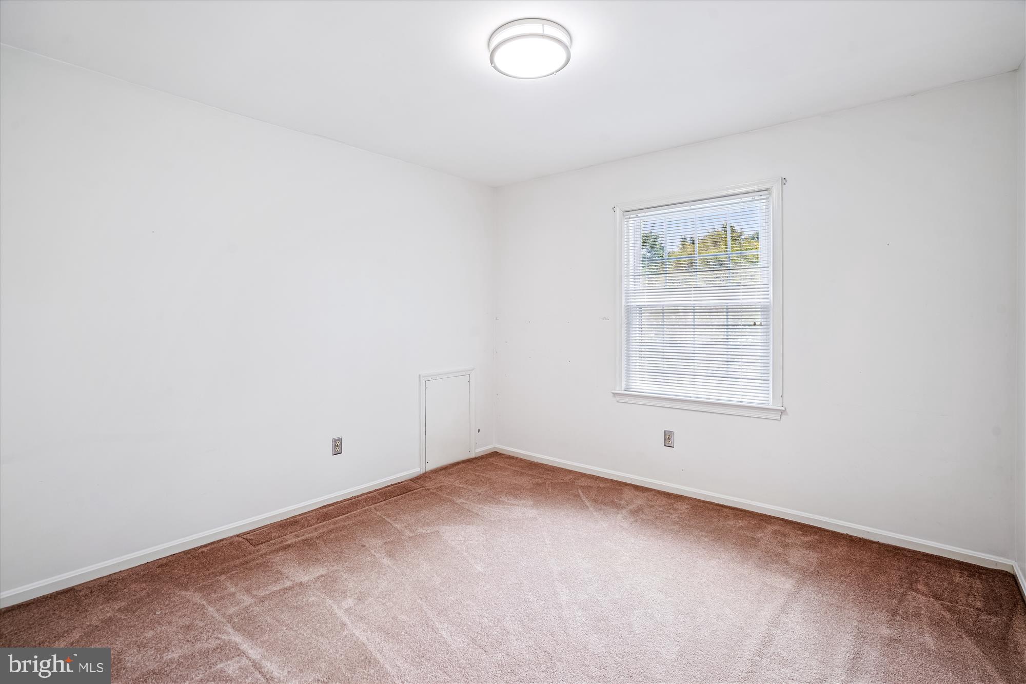1913 Hopefield Road Silver Spring, MD 20905 - Photo 41 of 58 an empty room with a window