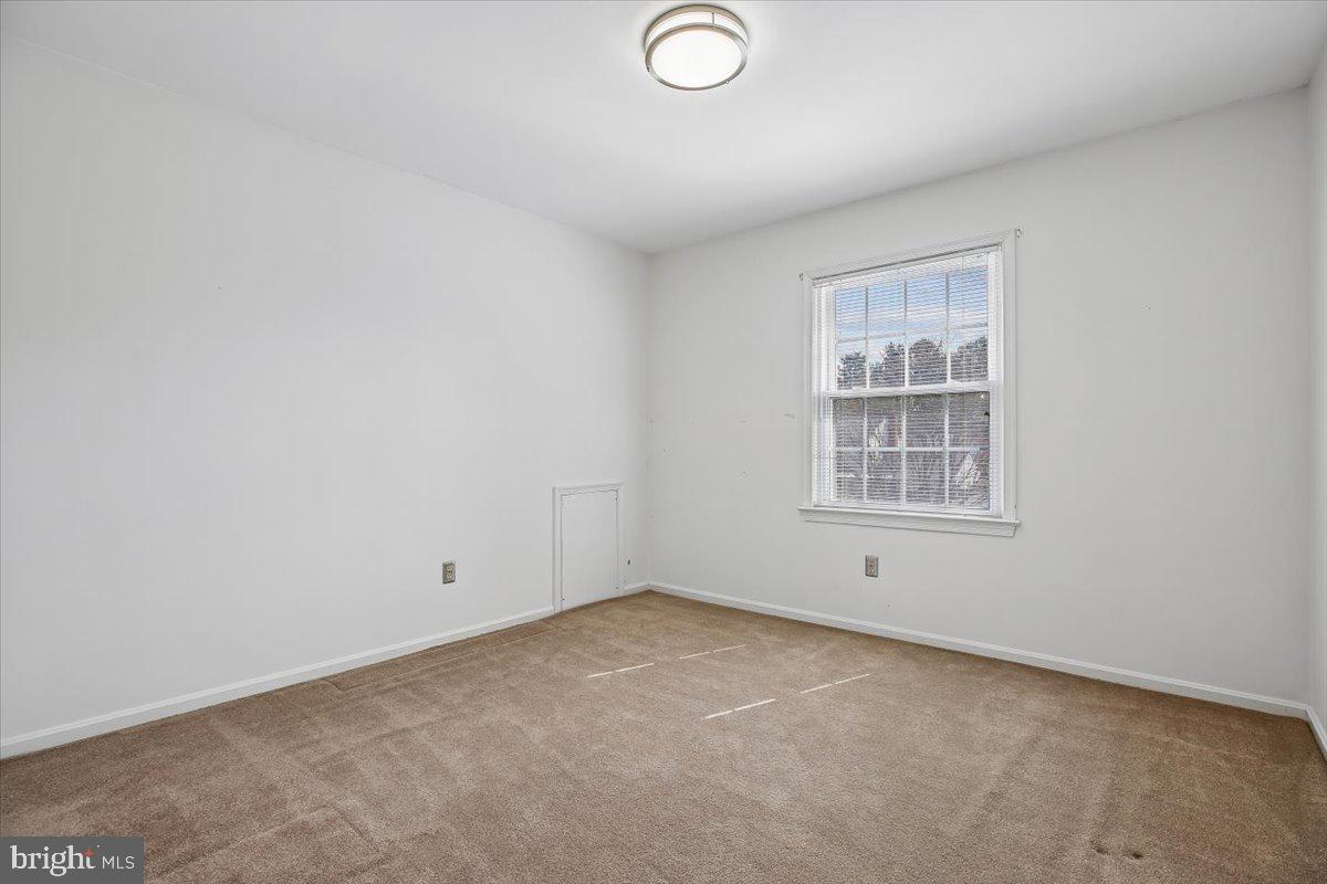 1913 Hopefield Road Silver Spring, MD 20905 - Photo 42 of 58 an empty room with windows