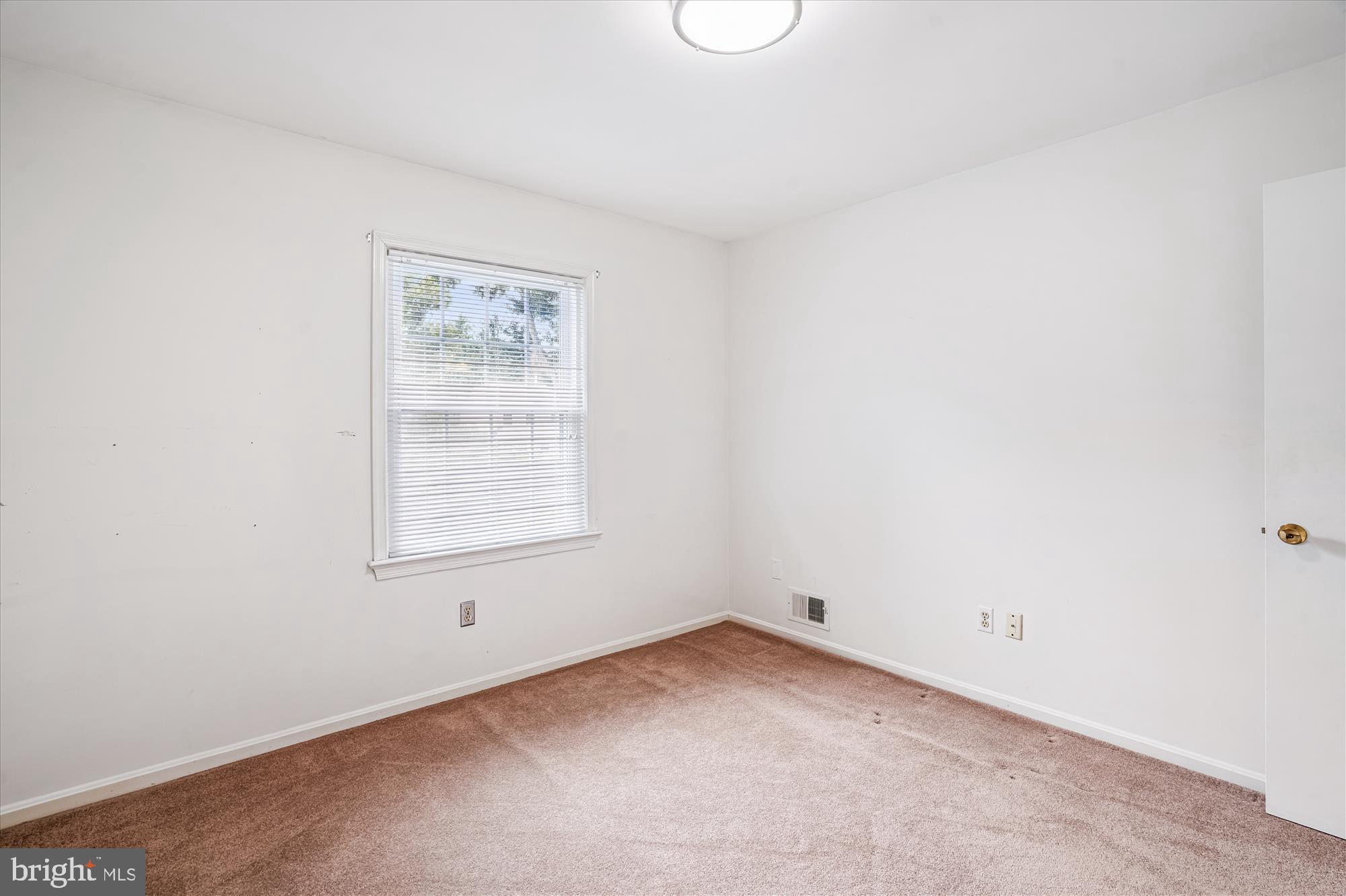 1913 Hopefield Road Silver Spring, MD 20905 - Photo 43 of 58 an empty room with a window