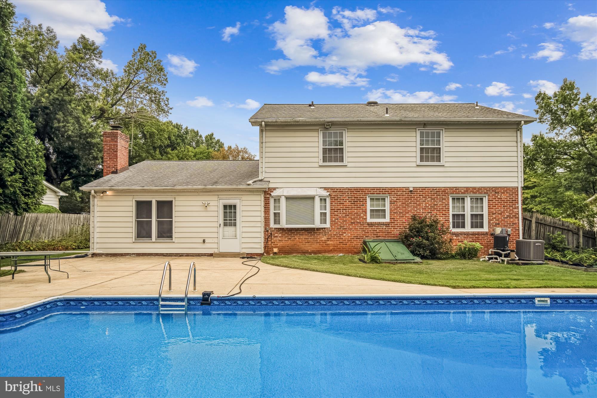 1913 Hopefield Road Silver Spring, MD 20905 - Photo 50 of 58 a view of a house with a swimming pool