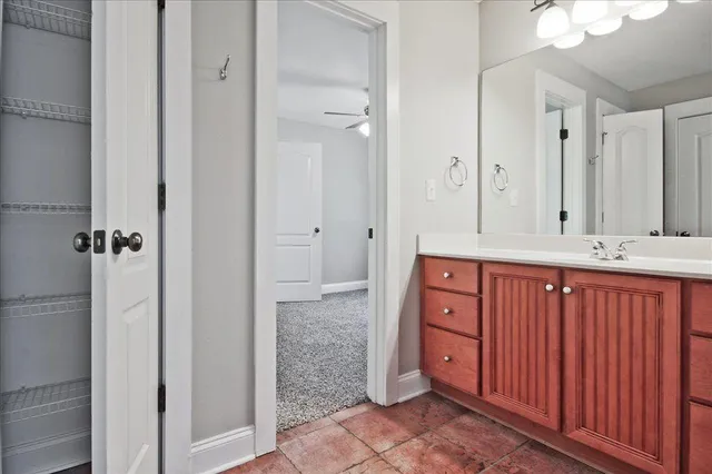 a sign that is sitting on a brick wall