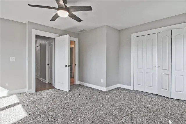a view of swimming pool with outdoor seating and house in the background