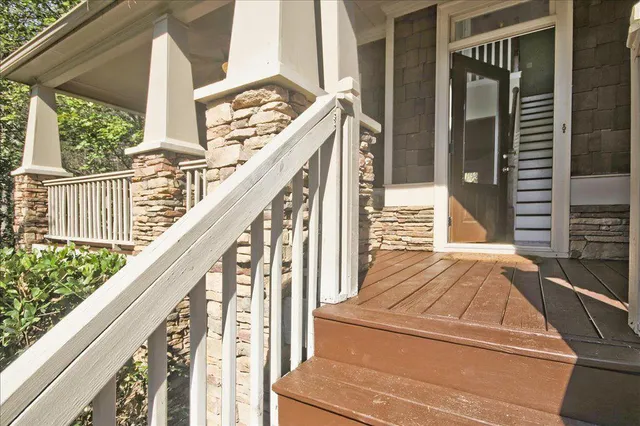 a view of an entryway with wooden floor