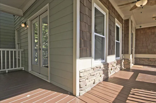 a view of entryway with wooden floor and front door