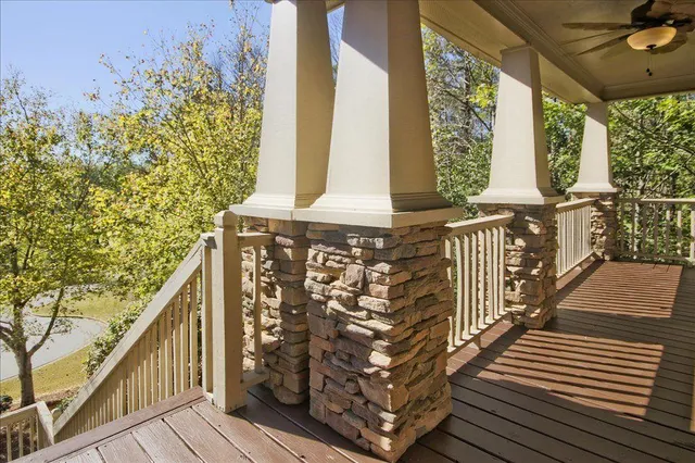 a view of staircase with wooden floor and white walls