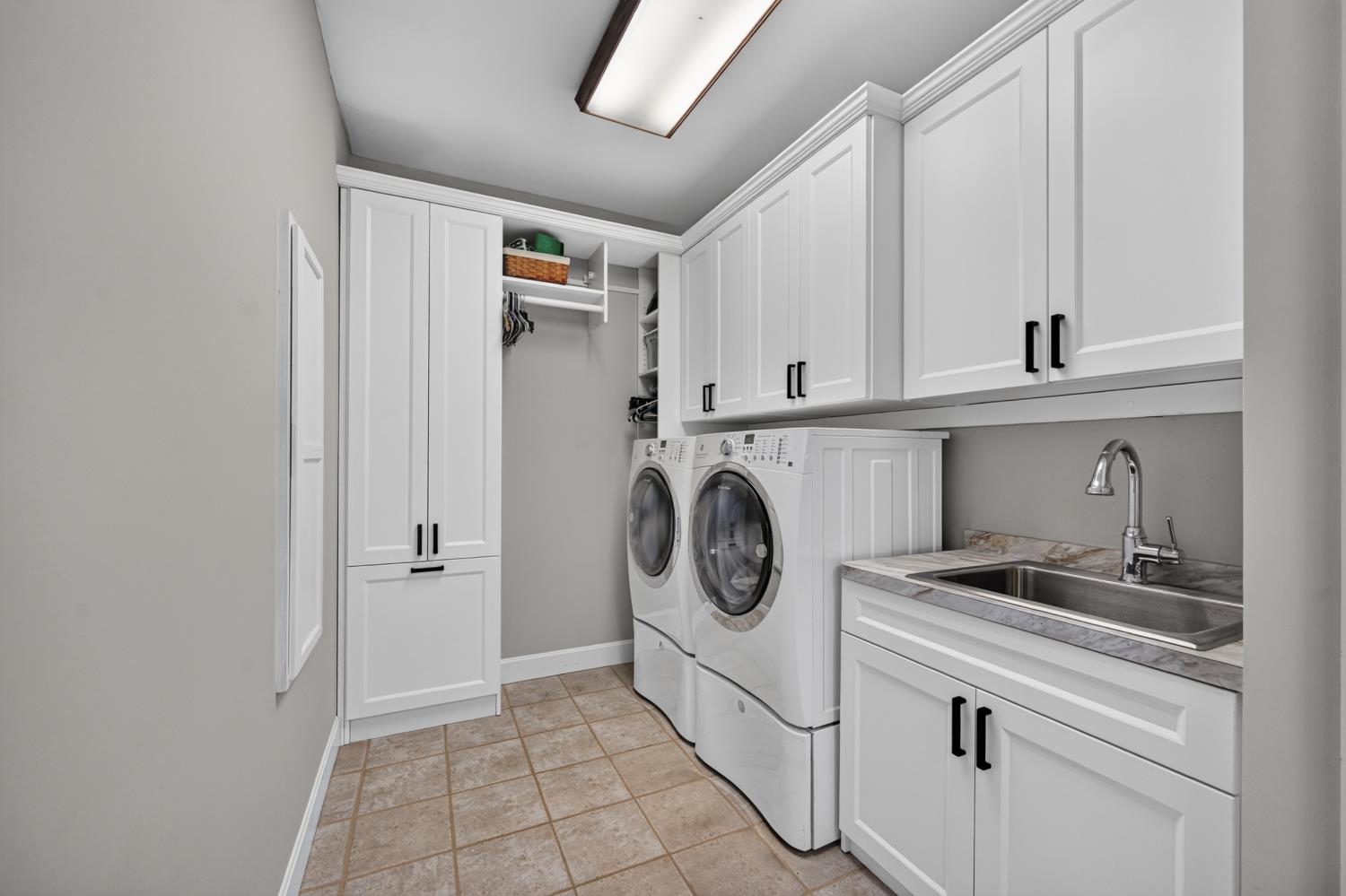 20980 State Line Road Lawrenceburg, IN 47025 - Photo 50 of 99 Awesome main level laundry has plenty of cabinets & deep sink