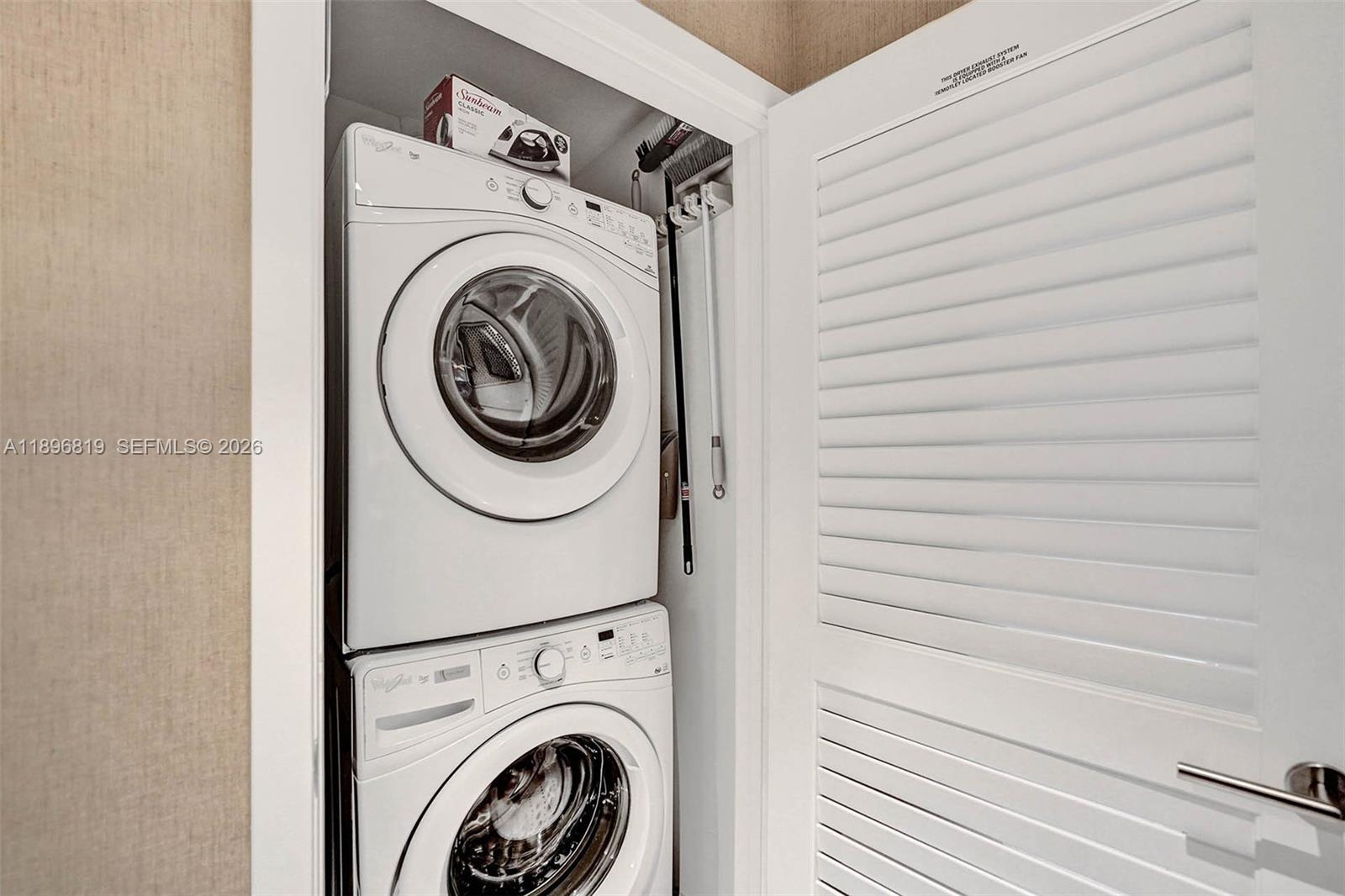 88 Southwest 7th Street, Unit 1408 Miami, FL 33130 - Photo 14 of 16 a utility room with dryer and washer