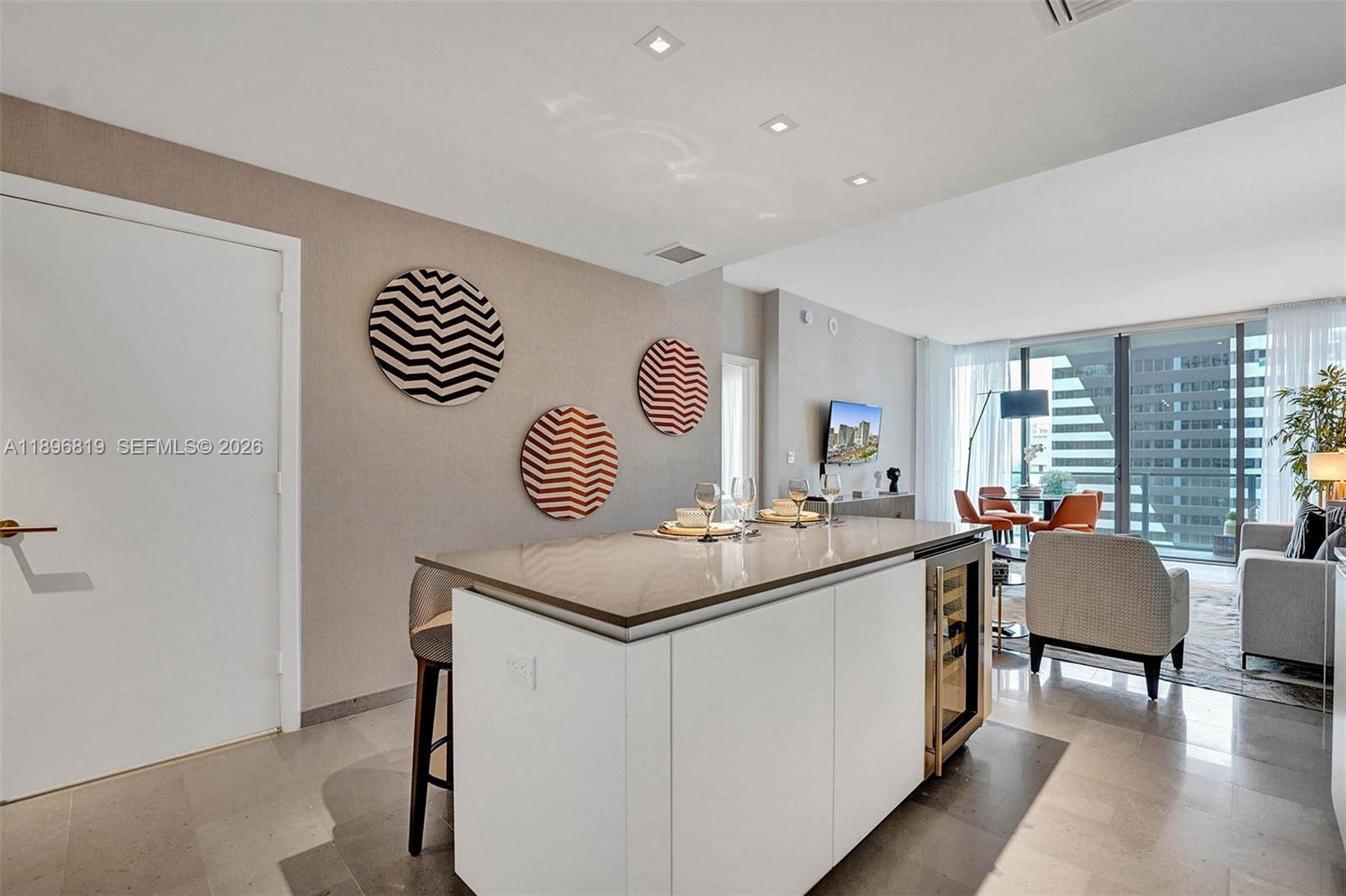 88 Southwest 7th Street, Unit 1408 Miami, FL 33130 - Photo 3 of 16 a kitchen with a sink and a stove top oven