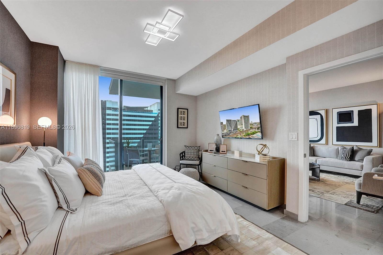 88 Southwest 7th Street, Unit 1408 Miami, FL 33130 - Photo 10 of 16 a bedroom with a bed and furniture