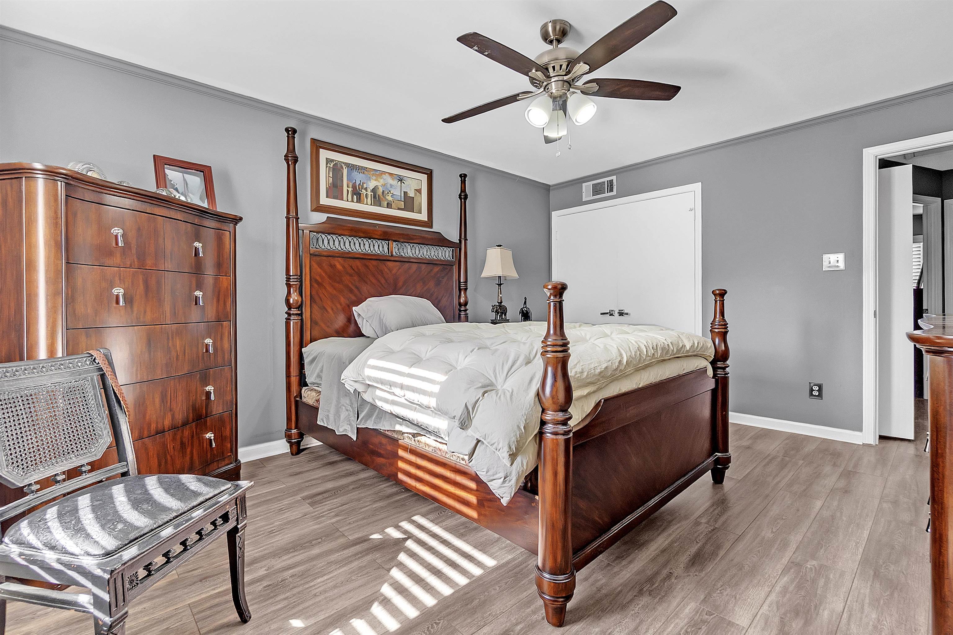 5866 Roxbury Drive, Unit 5866 Memphis, TN 38119 - Photo 11 of 16 Bedroom featuring light wood finished floors and ceiling fan