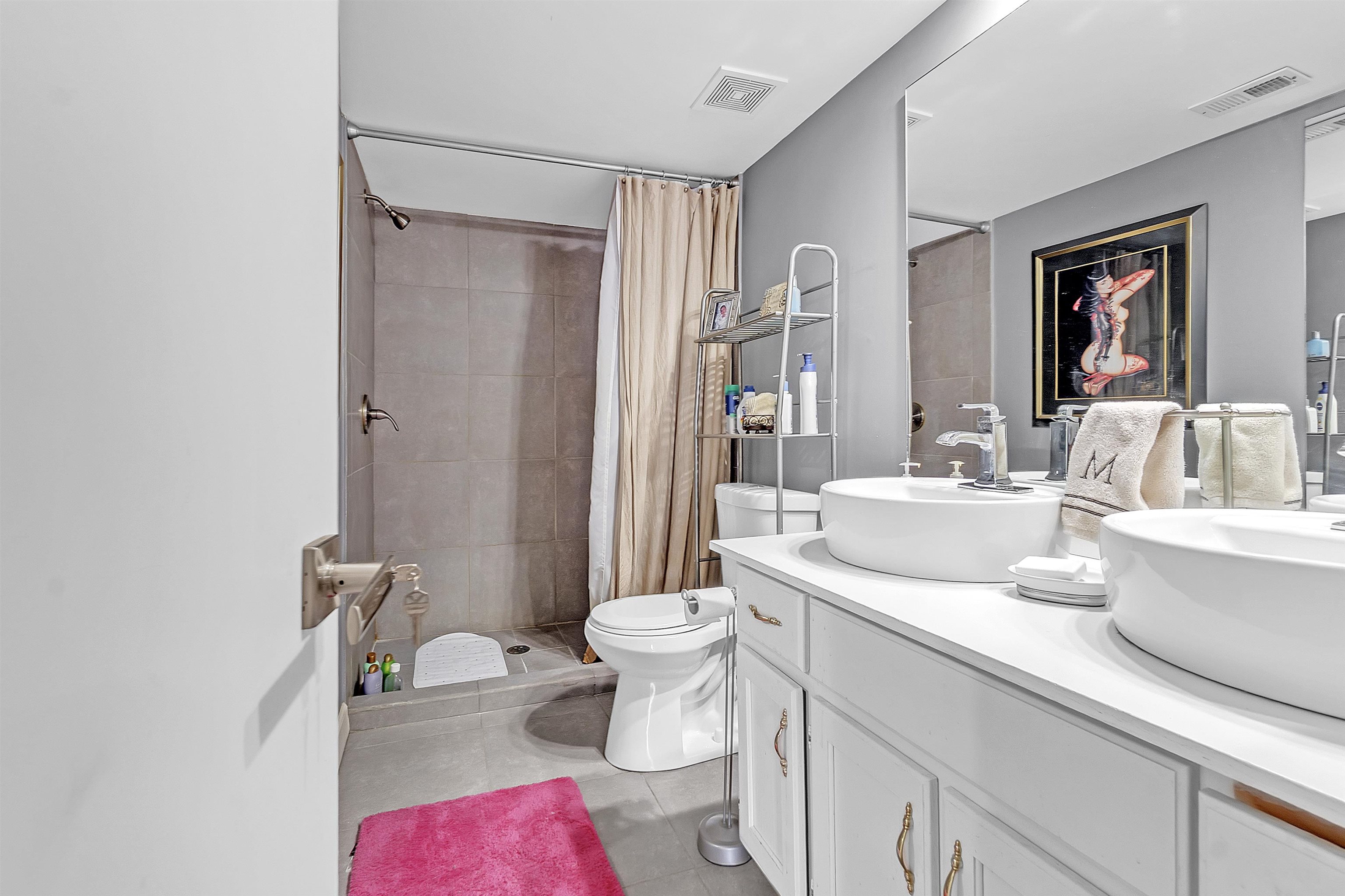 5866 Roxbury Drive, Unit 5866 Memphis, TN 38119 - Photo 13 of 16 Bathroom with a shower stall, double vanity, and light tile patterned floors