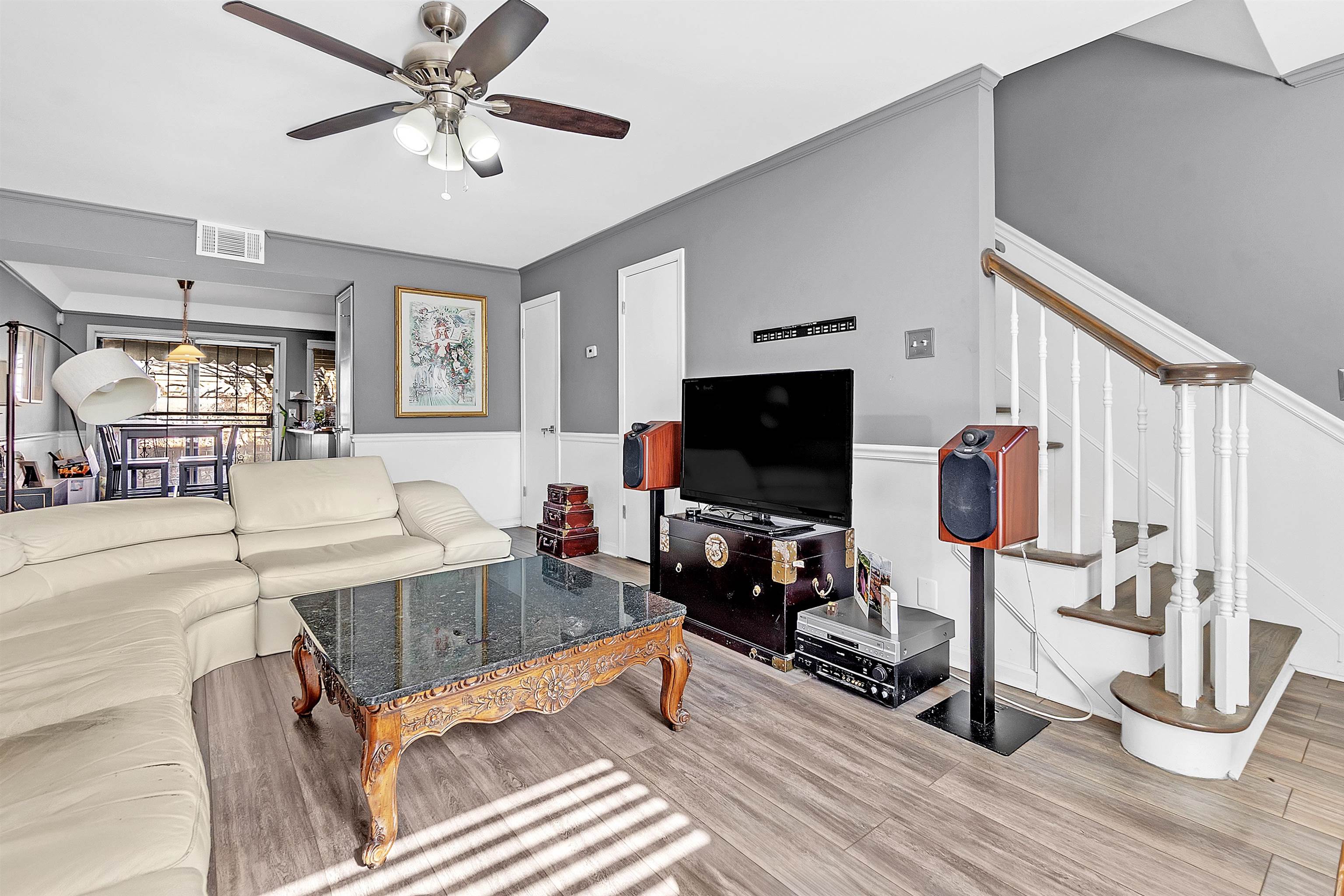 5866 Roxbury Drive, Unit 5866 Memphis, TN 38119 - Photo 3 of 16 Living room with wood finished floors, stairway, and ceiling fan