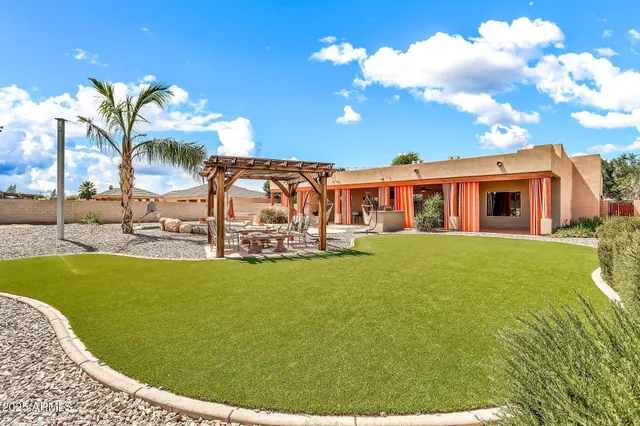 a view of a swimming pool and lounge chair