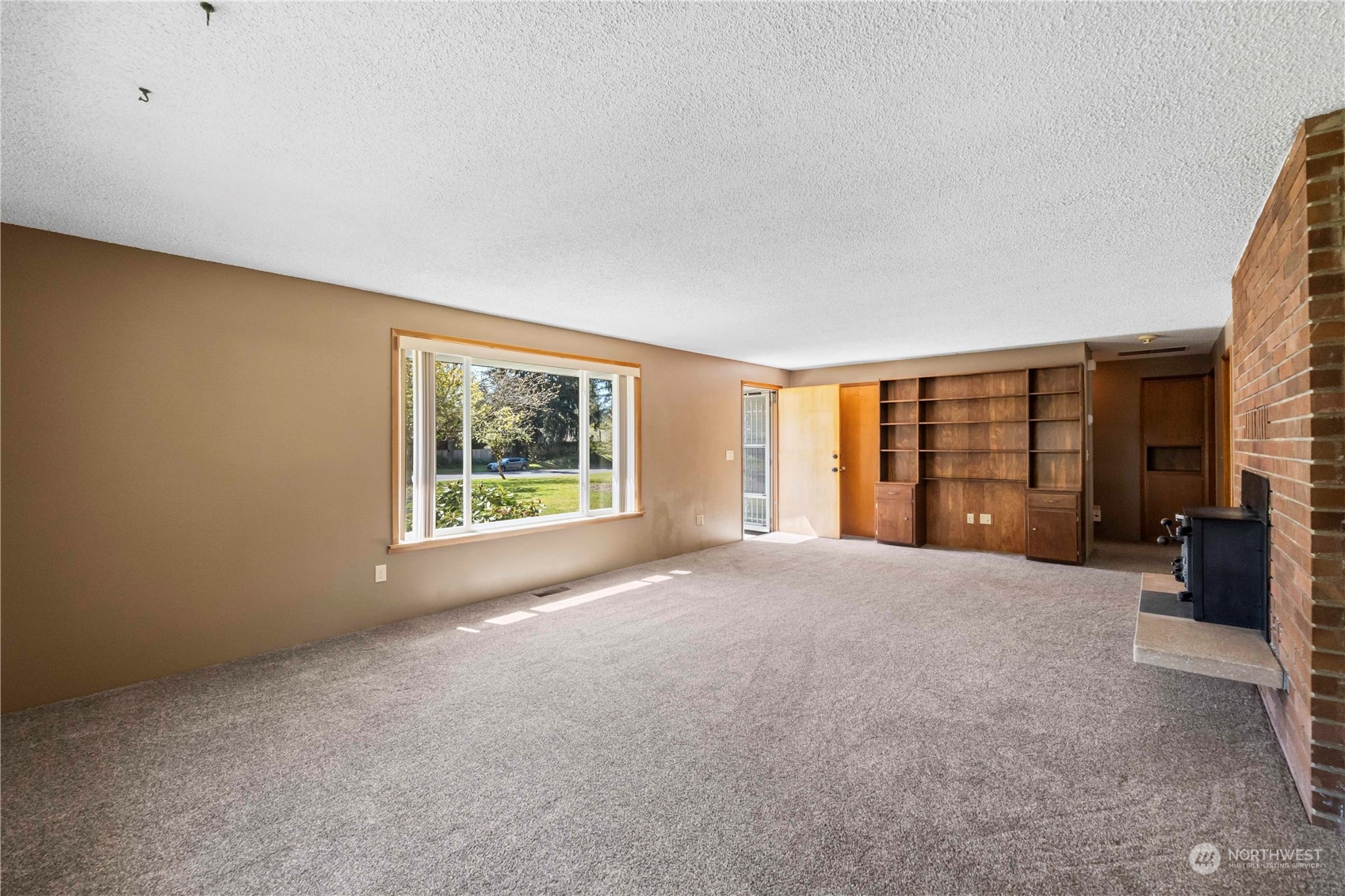 16238 Southeast 144th Street Renton, WA 98059 - Photo 12 of 32 a view of an empty room with a window