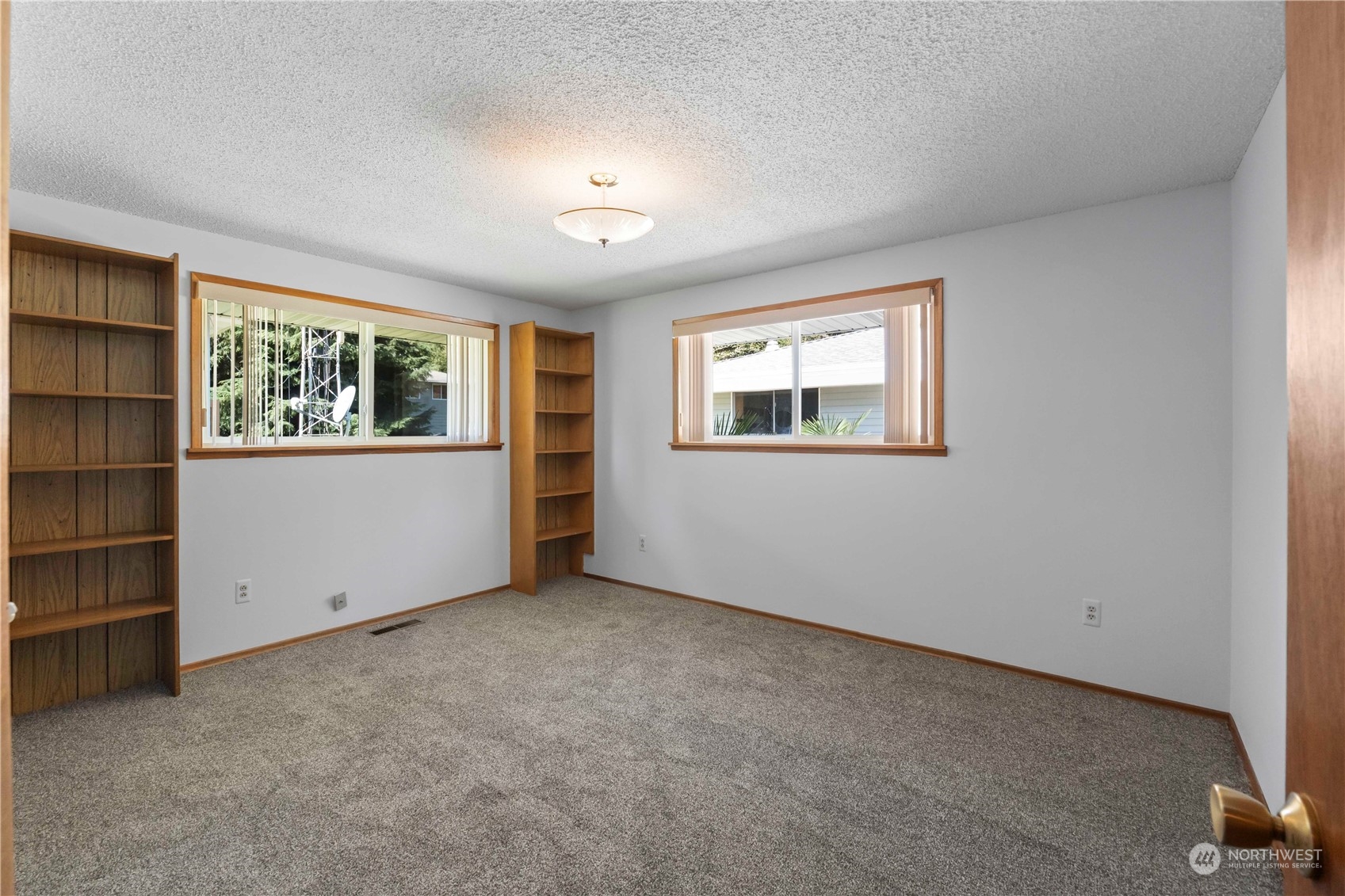 16238 Southeast 144th Street Renton, WA 98059 - Photo 19 of 32 an empty room with windows