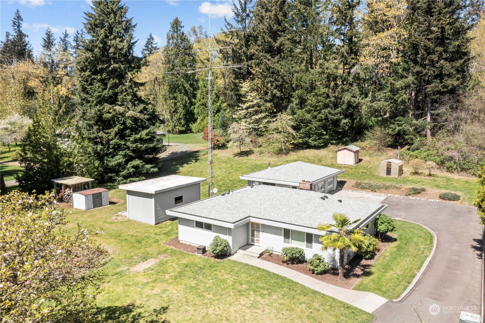 16238 Southeast 144th Street Renton, WA 98059 - Photo 2 of 32 an aerial view of a house with swimming pool and big yard