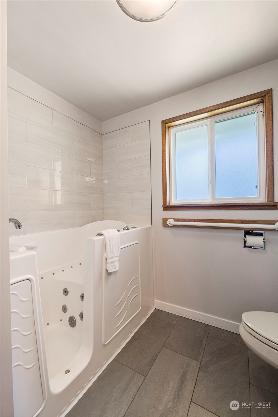 16238 Southeast 144th Street Renton, WA 98059 - Photo 21 of 32 a bathroom with a bathtub sink and toilet