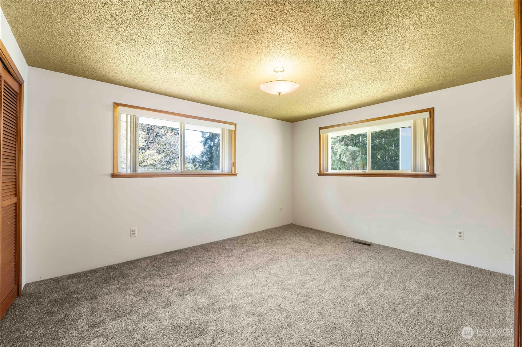 16238 Southeast 144th Street Renton, WA 98059 - Photo 22 of 32 a view of an empty room with a window