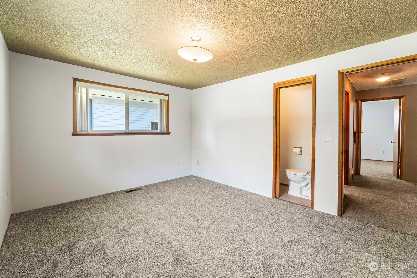 16238 Southeast 144th Street Renton, WA 98059 - Photo 23 of 32 a view of an empty room with a window