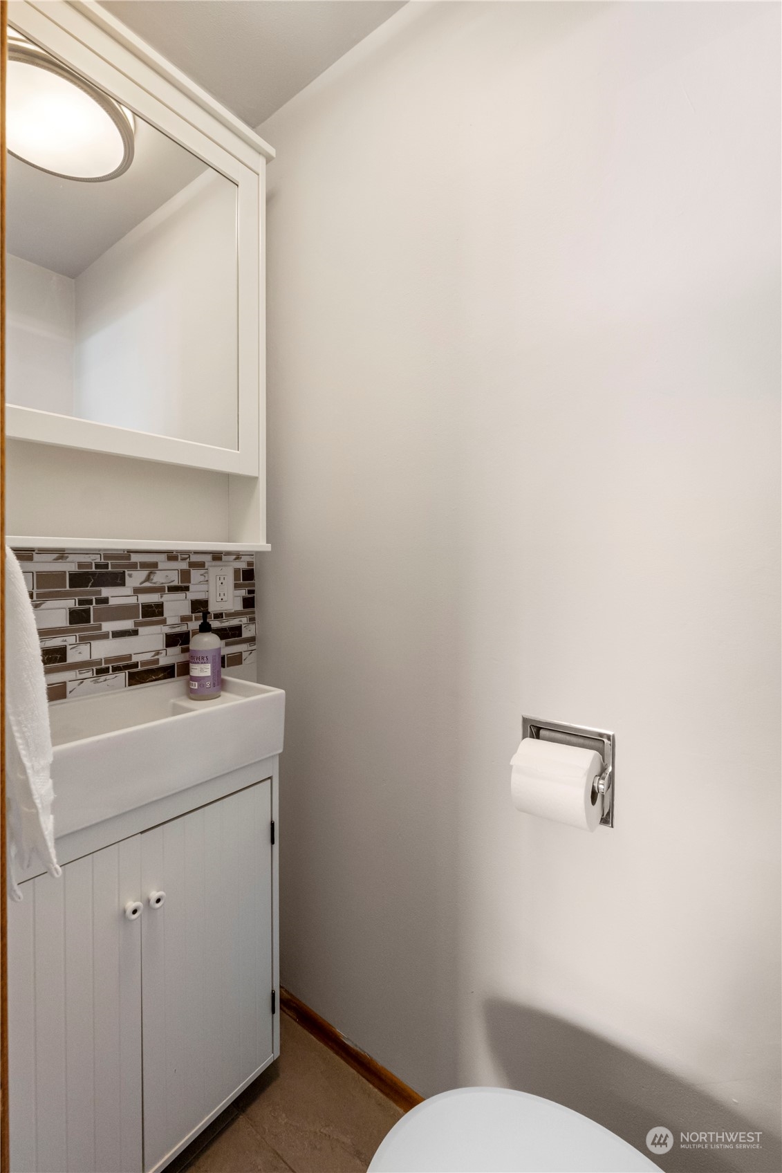 16238 Southeast 144th Street Renton, WA 98059 - Photo 24 of 32 a bathroom with a toilet sink and mirror