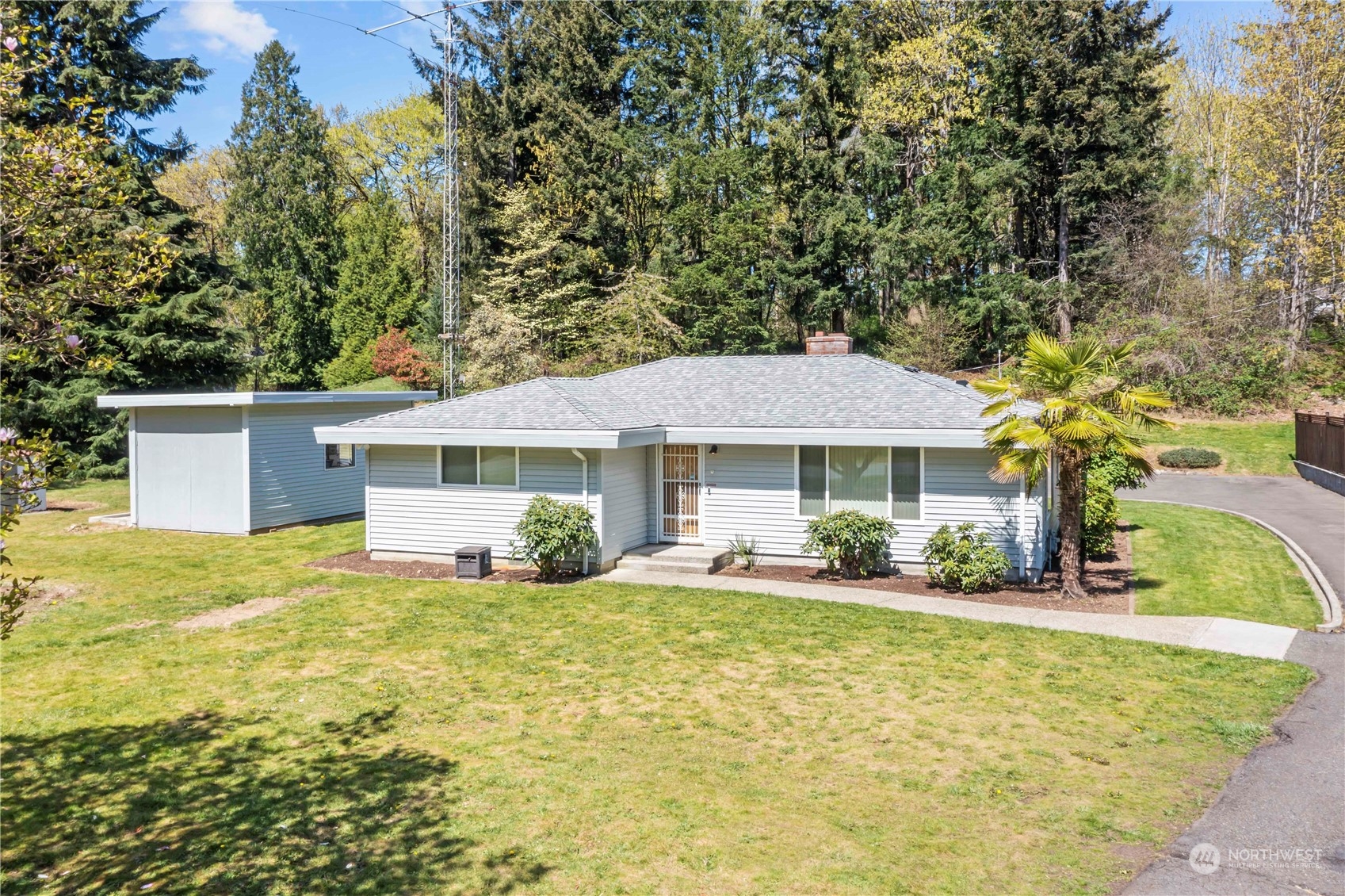 16238 Southeast 144th Street Renton, WA 98059 - Photo 3 of 32 a front view of a house with a yard
