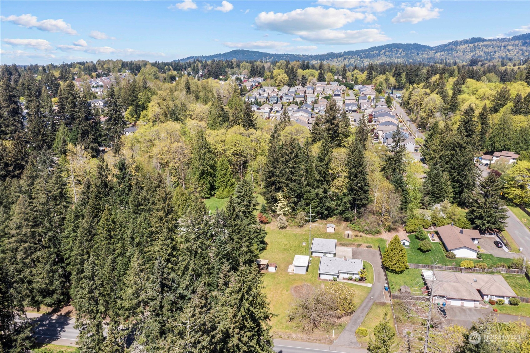 16238 Southeast 144th Street Renton, WA 98059 - Photo 8 of 32 an aerial view of residential houses with outdoor space and trees
