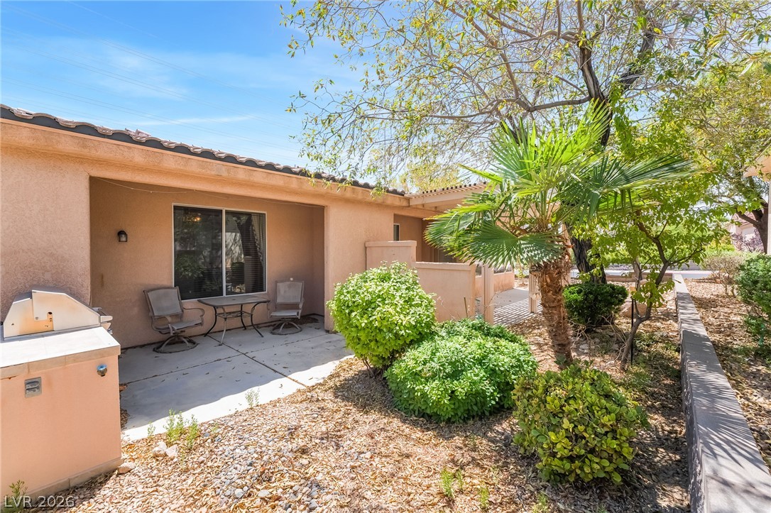 5389 Progresso Street Las Vegas, NV 89135 - Photo 28 of 41 A tranquil covered patio offers outdoor dining amidst low-maintenance landscaping and desert flora.