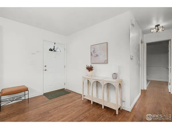 a view of a livingroom with wooden floor