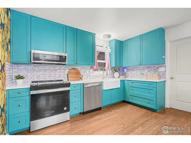 a kitchen with cabinets a sink and a stove