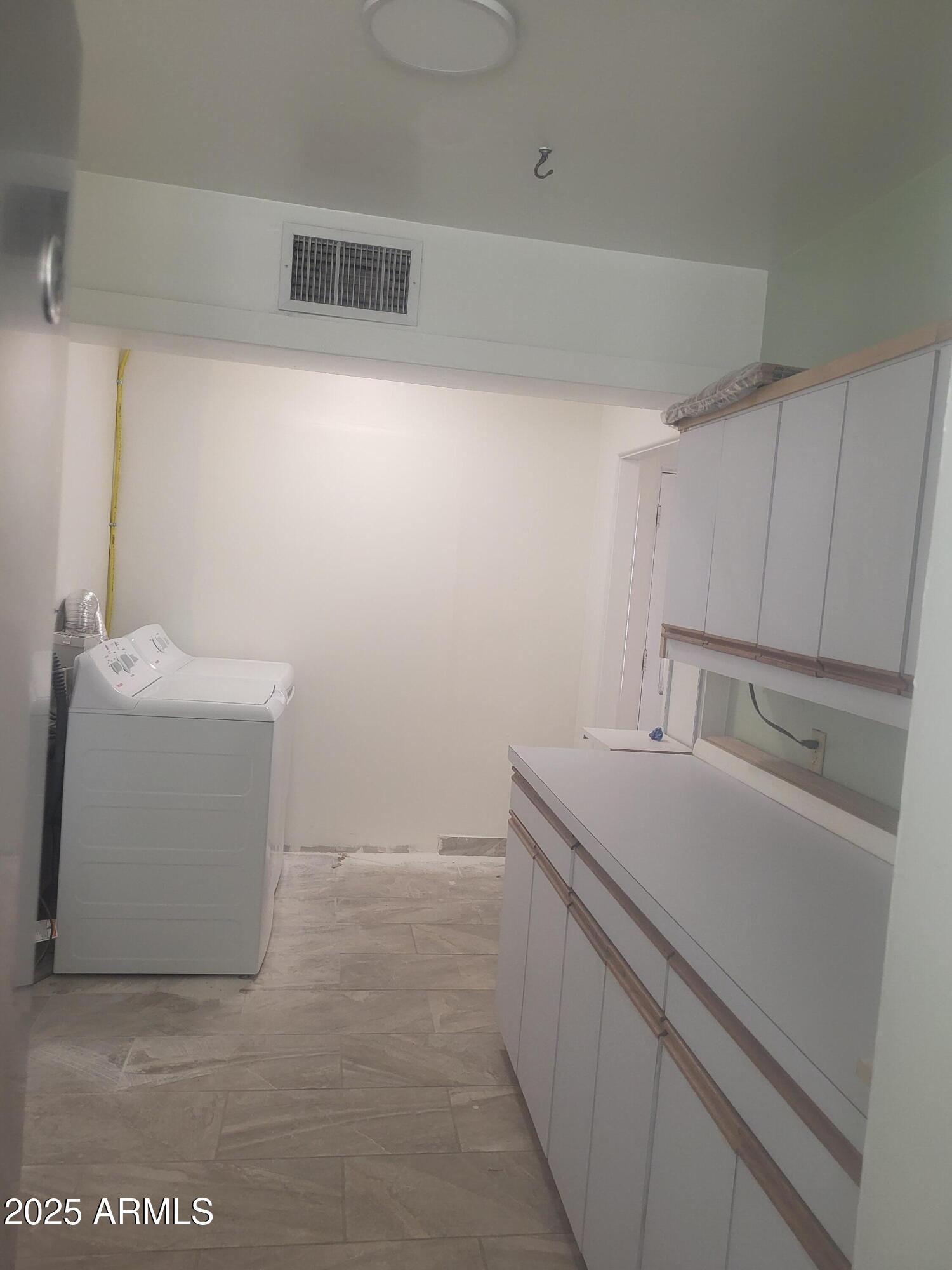 1704 West Colter Street, Unit 1 Phoenix, AZ 85015 - Photo 12 of 25 a utility room with dryer and washer