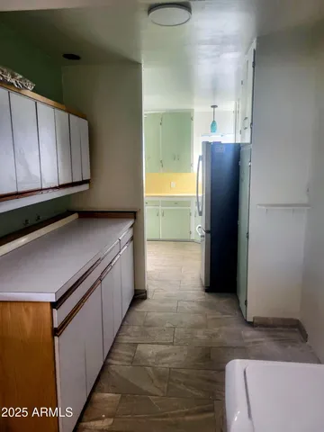 a bathroom with a sink and mirror with toilet