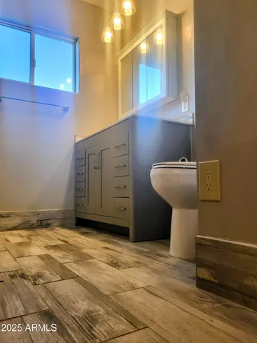 a bathroom with a glass shower door