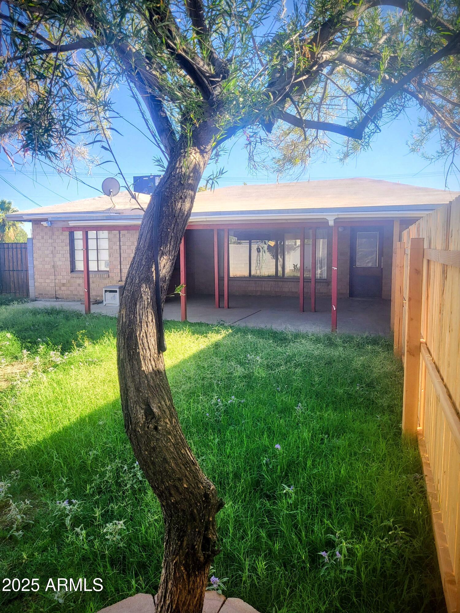 1704 West Colter Street, Unit 1 Phoenix, AZ 85015 - Photo 25 of 25 a view of a house with a backyard