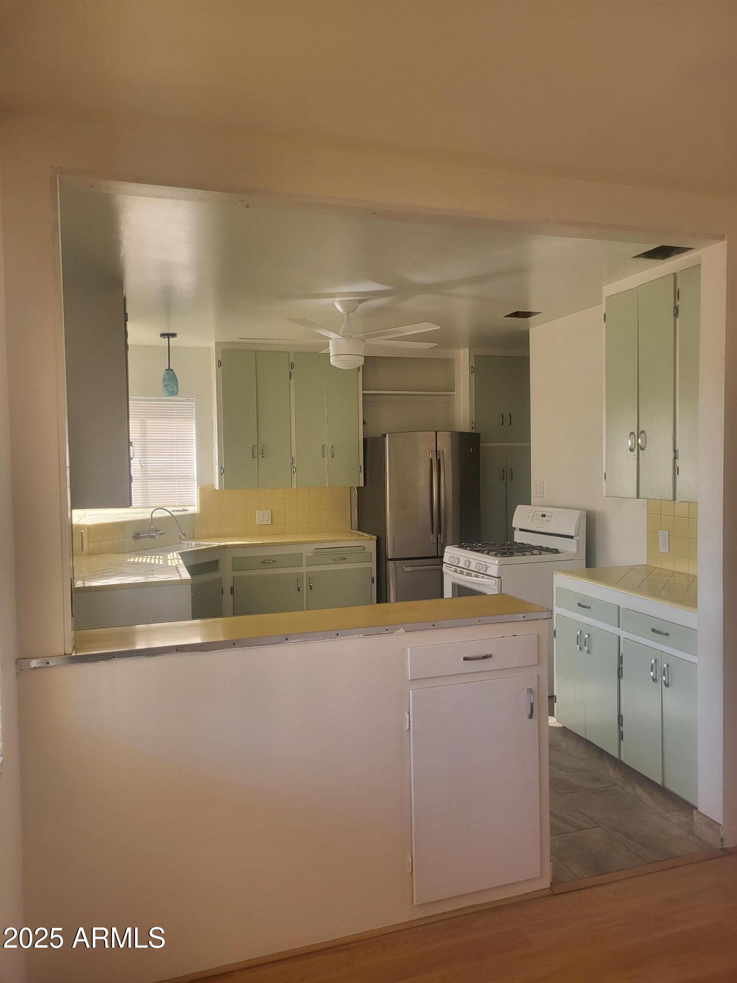 1704 West Colter Street, Unit 1 Phoenix, AZ 85015 - Photo 9 of 25 a bathroom with a sink and a mirror